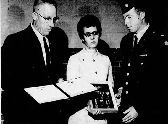 Mr. and Mrs. Pate Lester receive awards, presented posthumously to their son, Jimmy Don Lester, presented by Major William J. Kidd, at the Texas National Guard Armory in Amarillo.