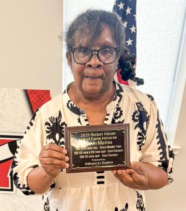 Renee Mathis proudly receives the 2025 Rocket House Hall of Fame distinction on behalf of her son, Jason Mathis, of Oklahoma City.