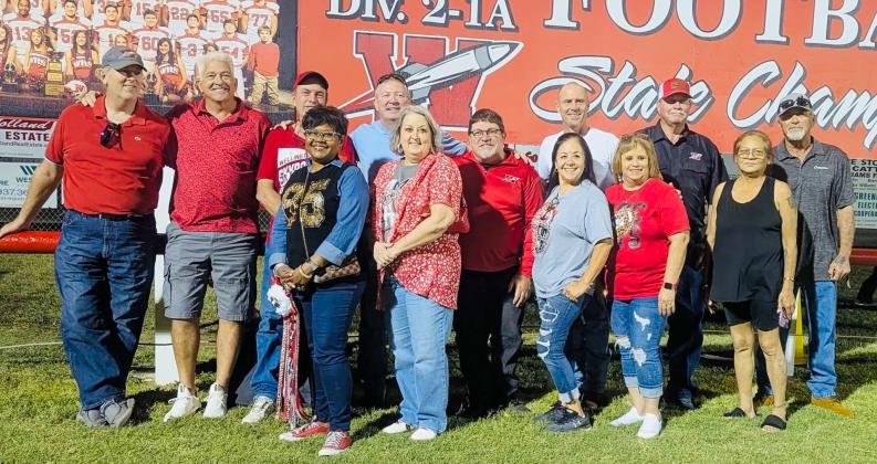 The Wellington High School Class of 1985 celebrates its 40th class reunion in conjunction with the 2025 Skyrocket homecoming football game. Front row, from left: Brenda Powell Brown, Lori Lacy Gillem, Becky Sanchez Hinojosa, Carmen Garcia Henson, guest Mrs. Tony Molina. Back row, from left: Brian Wilbur, James Benton, Jerry Dan Davis, Jamie McKay, Dell Davis, Chris Hayes, Michael Souder, Tony Molina.