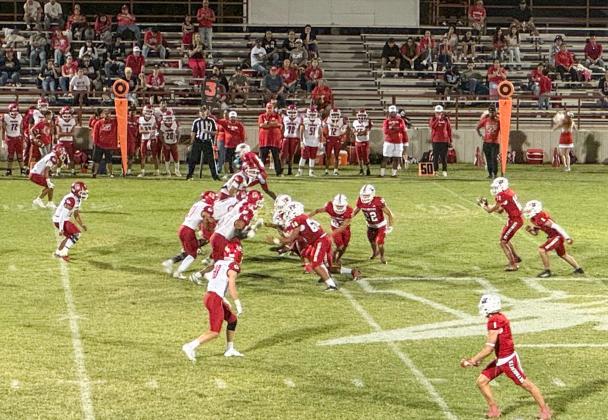 Wellington quarterback Callen Kane receives the ball and completes the pass, amassing 240 yards passing during the Skyrockets’ 48-28 homecoming win against Friona Friday, Sept. 12 at Powell Field in Wellington.