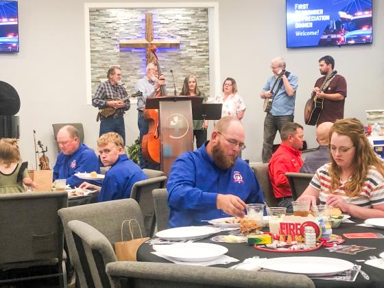 The Sain family, including, from left, Mort Sain, Oran Sain, Donna Lewis, Misty Cummings, Jeremy Sain and Jeffrey Lewis, perform old hymns in a Bluegrass style Sunday evening, Sept. 28, as entertainment during the Collingsworth County First Responder Appreciation Dinner, hosted by Calvary Baptist Church.