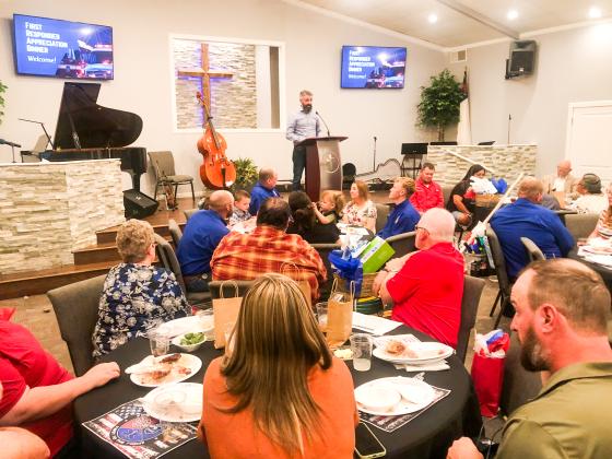 Pastor Noah Downing expresses his gratefulness for members of Samnorwood Volunteer Fire Department, Wellington Volunteer Fire Department, Wellington Emergency Medical Services and the Collingsworth County Sheriff’s Office who served as guests of honor at the Sunday evening appreciation banquet.