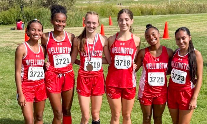 Under the leadership of Lady Rocket cross country coach Travis Nicks, Taytum Kane earns the fourth-place medal at the Lubbock Invitational on Saturday, Sept. 27. Following, the Lady Rocket cross country team competed at the Wheeler Invitational on Wednesday, Oct. 1. Results were unavailable at press time. From left: Kobee Lewis, Angela Lewis, Kane, Anna Henard, Aleah Lewis and Sabrina Segovia.