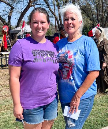 Claiming second place in the Living History Ice Cream Freeze-Off, Samantha Bohannon, left, entered her creamy chocolate ice cream, while first prize winner Debbie Huntress prepared her vanilla peach ice cream.