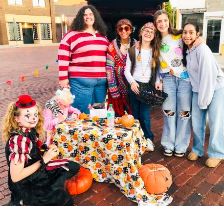 The Henard sisters share their homegrown 2025 pumpkin crop with Collingsworth County Chamber of Commerce Trunk-or-Treaters on the south side of the downtown square from 5:30-7 p.m. Thursday, Oct. 30. Visitors chose a mini pumpkin and painted the keepsake treat. From left: Aubree Richard, Blake Lemons, Rileigh Henard, Seveyah Pena, Evelyn Henard, Anna Henard, Aundrea Garcia.