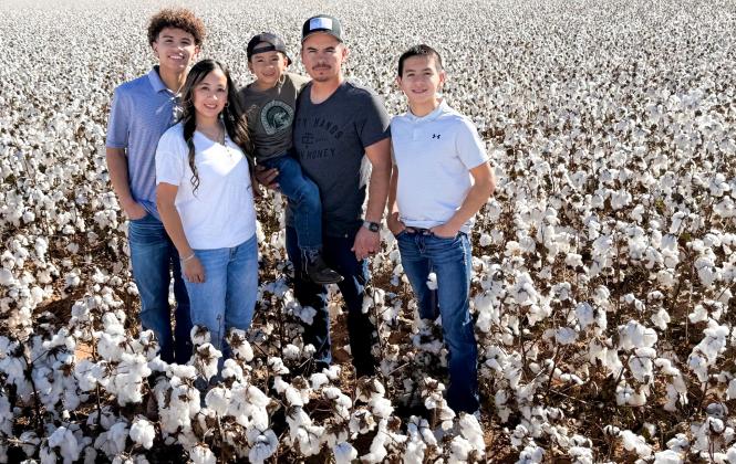 Bawcom Farms harvested the first bale of the 2025 cotton crop, ginned on Friday, Oct. 10, at Farmers Cooperative Society #1 in Wellington. Representing Bawcom Farms is Tino Salinas, the farming entity’s sole farmhand, and his family. From left: TJ, Shauna, Alejandro, Tino and Dahmian Salinas.