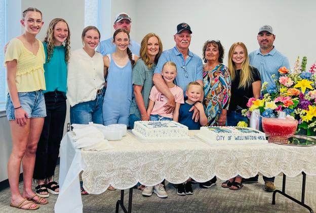 Joined by his family, Arnie Ingram celebrates his retirement following 45.5 years of service to the City of Wellington Friday, June 20 in the Club Room of the Bura Handley Communtiy Center.