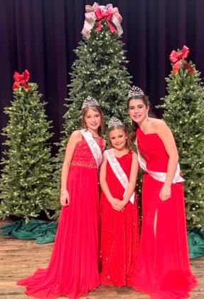 Junior Miss Wellington 2026 Peyton Roberson, left, Little Miss Wellington 2026 JoLee Breedlove and Teen Miss Wellington 2026 Quinn Roberson center the stage of the elegantly attired Wellington Ritz Theatre stage following the Sunday afternoon, Dec. 14 pageants.