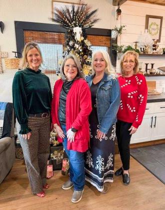 Receiving Hearts United Give Support (HUGS) Holiday Home Tour supporters at the rural Huntress home are HUGS volunteers Amy Inman, left, Linda Porter, Debbie Huntress and Lennie Statham.