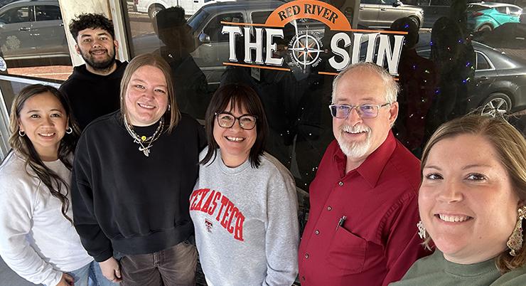 Red River Sun employees Shauna Salinas and Synghyn Beasley-Vasquez with Managing Editor Elizabeth Tanner, Clarendon Enterprise Advertising Manager Tara Allred, and new owners Roger and Ashlee Estlack.