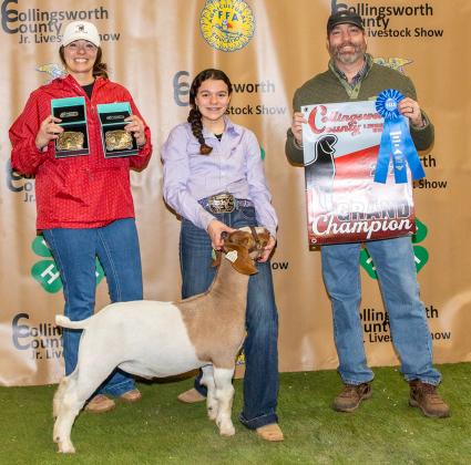 Kenzlea Taylor shows the Grand Champion Goat, purchased by 3J Farms-John Patterson at the Premium Sale.