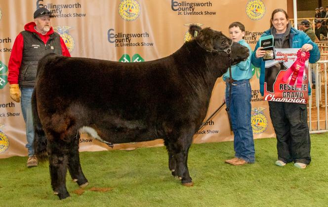 Jacob Page exhibits the Reserve Champion Steer, purchased by Circle TK Land and Cattle at the Premium Sale.