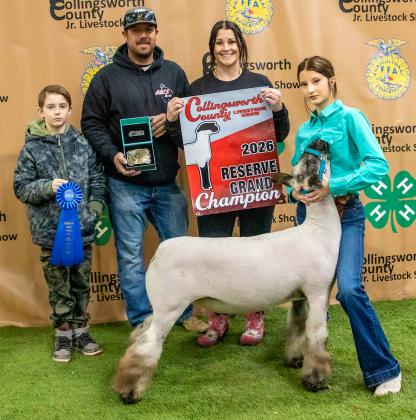 Chloe Peters shows the Reserve Champion Lamb, purchased by M&amp;M Livestock at the Premium Sale.