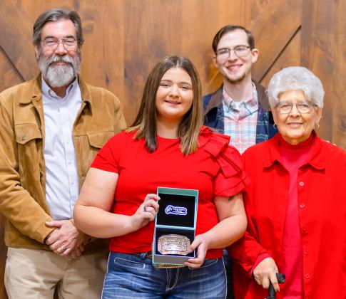 Wellington High School senior Jacy Lampe receives the Herdsmen Award in honor of the late Don Reeves during the Collingsworth County Livestock Association’s dinner and sale Saturday evening, Jan. 17 at the Bura Handley Community Center. From left: Wes Reeves, Jacy Lampe, John Reeves, Katherine Reeves.