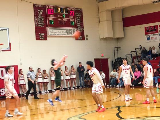 The Highland Park Hornets hoist the ball toward the goal at the sound of the buzzer Thursday evening, Jan. 22 in Wellington, securing the Wellington Skyrockets’ 103-23 win.