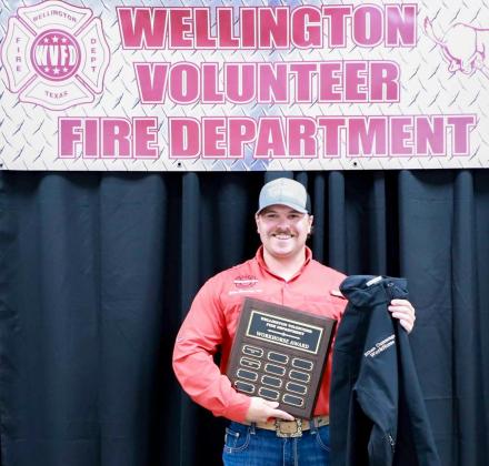 Voted on by members of Wellington Volunteer Fire Department, Ethan Cummings accepts the Workhorse Award.