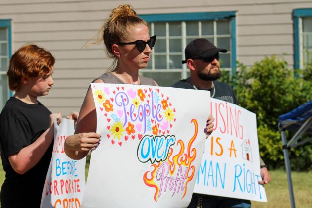 Local residents protested the sale of Madison Chase to AL’s Village-Condominiums, which has left residents of the 75-unit apartment complex homeless.