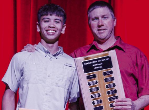 Junior TJ Salinas garners the Most Valuable Player award for Skyrocket baseball, presented by Coach Jeff Anderson.