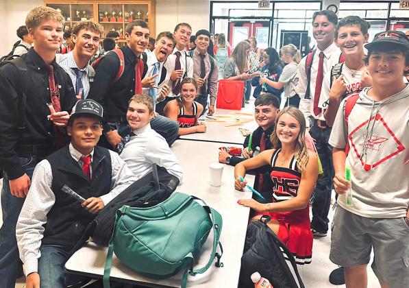 Wellington High School Principal Deidre Kane passes out popsicles during break in the Commons on Friday morning, Aug. 28, pumping up the student body for the Skyrockets versus Spearman Lynx football game.