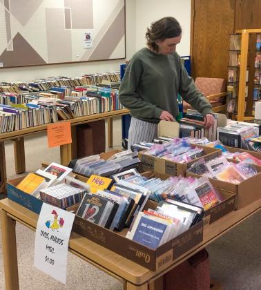 Librarian Susie Klassen sorts through the selections at Collingsworth Public Library’s Annual Book Sale, happening now in the Omni Room. Get two for the price of one, two books for $1, two paperbacks for $0.25 or two audiobooks for $1. For additional information, visit Collingsworth Public Library on Facebook, email library79095@gmail. com or call 806-447-3183. The Red River Sun/Bev Odom
