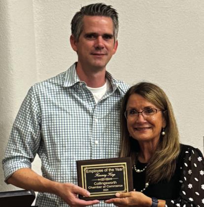 Kenney Keys, left, a Physical Therapist at Collingsworth General Hospital, accepts Employee of the Year from Collingsworth County Chamber of Commerce President Karen Caldwell.