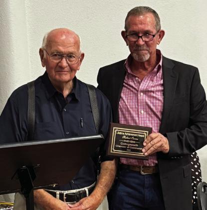 Robert Owens, left, is presented the Lifetime Achievement Award by Collingsworth County Chamber of Commerce Volunteer Jeff Thomas.