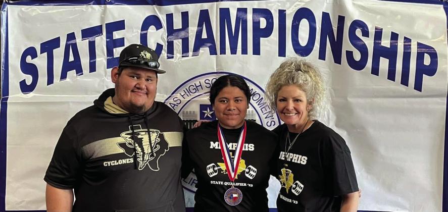 Senior powerlifter Emili Martinez, coached by assistant powerlifting coach Jose Duran, left, and powerlifting coach Michelle Branigan, right, brings home a fourth-place finish in weight class 198.