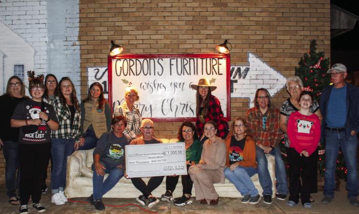 Childress Farmers Market makes donation to Childress Downtown Historical Association during evening finale