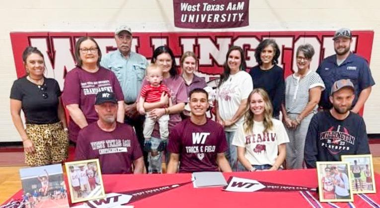 Surrounded by his family, Wellington High School senior Major Brown signs his National Letter of Intent to continue his track and field career at West Texas A&amp;amp;M University Thursday, April 23. Front, from left: his dad, Daryon Brown, M. Brown, sister Marlee Brown Killian, brother Nathan Brown. Back row, from left: Lauren Patterson, Marie White, Pat White, Boone and Emily Cummings, Addisyn and Landree Wood, Leslee Wood, Lesa Thornberry, Cathy Needham, Matt Needham.