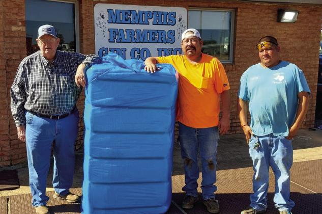 Memphis’ Jim Stewart, left, harvests the first bale of the 2024 cotton crop ginned at Memphis Farmers Gin Cooperative, Inc. Thursday, Oct. 24. Stewart, who also serves the First Baptist Church of Memphis Minister of Music, farms cotton in the surrounding area. A graduate of Memphis High School, he attended West Texas A&amp;amp;M University, where he earned a Bachelor and Master of Arts in Music, which he used to teach music at Clarendon College prior to his retirement. Courtesy Photo