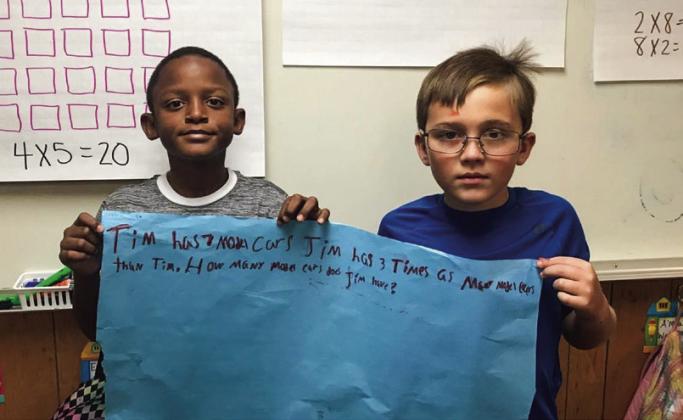 Austin Elementary School educator Norma Ross’ third-grade class recently learns how to write multiplication stories, teaming up to show off their skills. Photos Courtesy of Memphis ISD