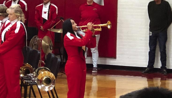 Senior Jossaline Moreno performs “Taps” on her bugle.