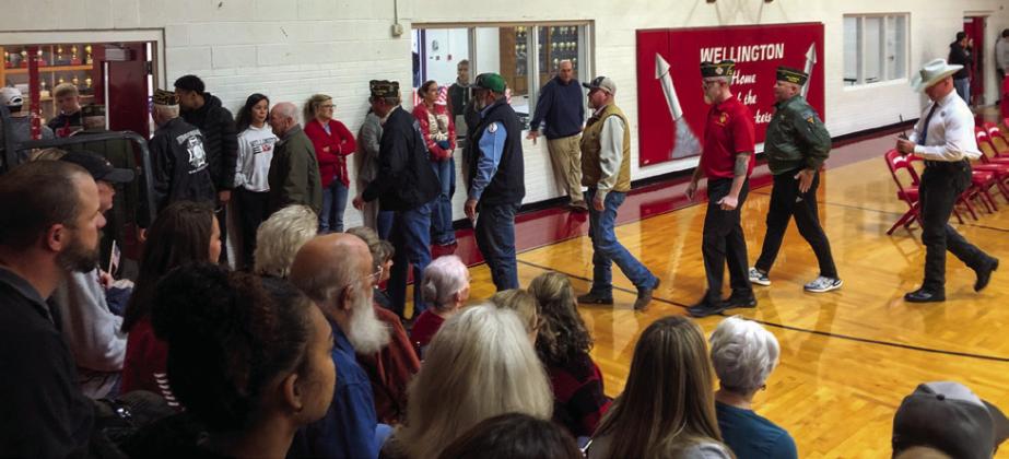 Enrique Jaimes, Jordan Nation, Hunter Stark and Trenton Wright escort the veterans and their guests to the commons for a reception in their honor.