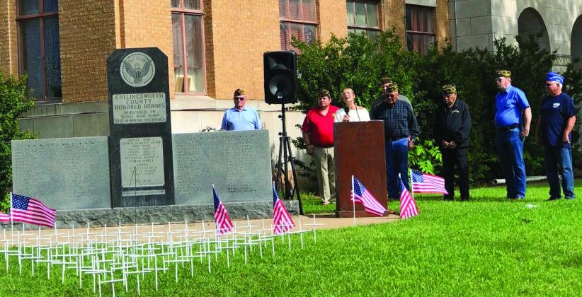 Wellington High School senior Madeleine Kane performs the National Anthem during the Memorial Day service at the Collingsworth County Honored Heroes Veterans Memorial. Officers of Glynn Moore Veterans of Foreign Wars Post 6439 Tony Stephens, left, Benito Castillo, Jr. Castillo, Michael Stanley, Adam Sosa, Jeff Pastor and John O’Rear conducted the ceremony. The Red River Sun/Bev Odom