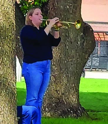 Rocket Regiment junior Allie Linville plays “Taps” to close the solemn Memorial Day occasion. Courtesy Photo