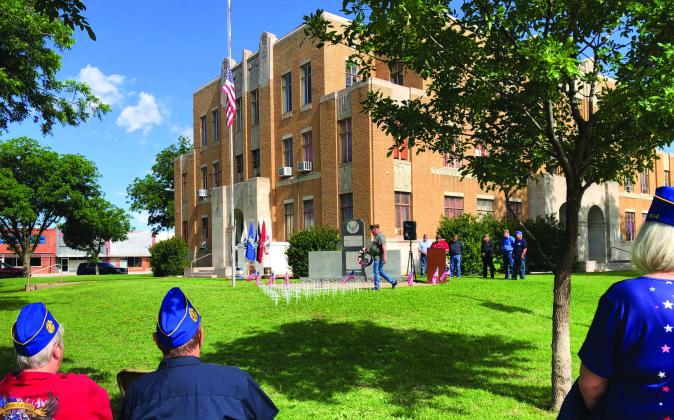 Senior Vice Commander of Glynn Moore Veterans of Foreign Wars Post 6439 Michael Stanley places the wreath as a symbol of remembrance during the 10 a.m. ceremony Monday, May 29 on the courthouse lawn. The Red River Sun/Bev Odom
