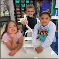 Austin Elementary School students recently practice teamwork while building note-card towers. Through the project, students learned how to share their ideas while listening to others. Photos Courtesy of Memphis ISD