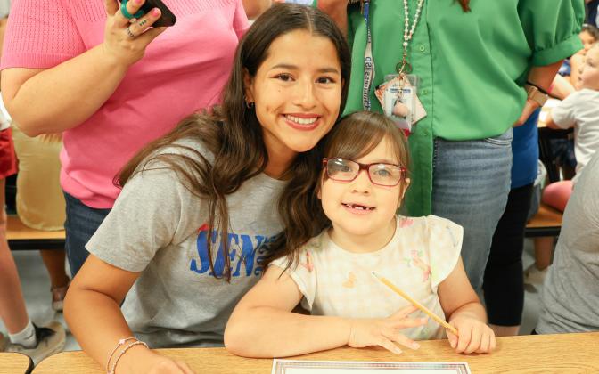 Kindergarteners, seniors team up for Kindergarten Signing Day