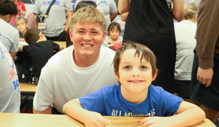 Kindergarteners, seniors team up for Kindergarten Signing Day