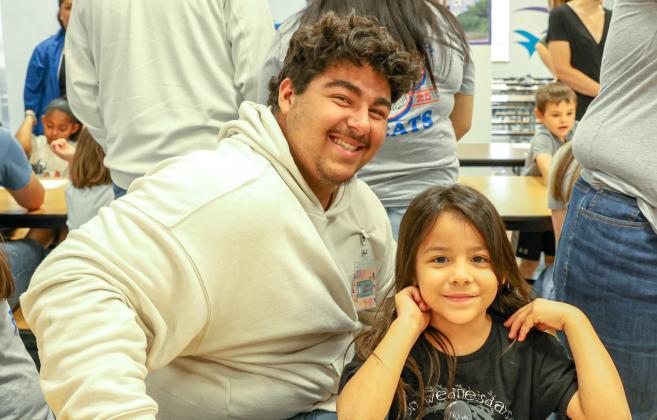 Kindergarteners, seniors team up for Kindergarten Signing Day