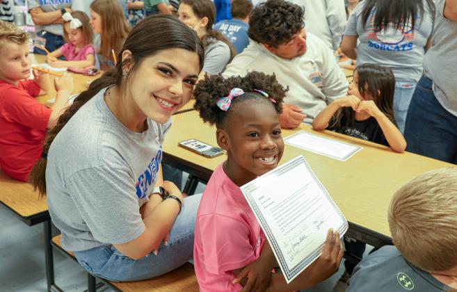 The Childress Elementary School Class of 2037, joined by the Childress High School Class of 2025, team up for Kindergarten Signing Day Tuesday, May 20 at Childress Elementary School. Through the Lens of Liz