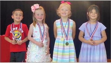 Rhae Jones’ Head Start students accept awards as follows. From left: Oscar Granadoz, Most Improved; Kylie Wiebe, Most Improved; Charleigh Henard, American Citizenship; Alina Rincon, American Citizenship.