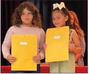Chandi Taylor’s first graders accept special awards as follows. From left: Elena Granados, Most Improved; Royalti Navarro, Most Improved.