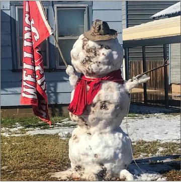 Skyrocket fans in the 1400 block of El Paso St. appropriately attire a snowman, bundled with a Rocket red scarf and displaying a Wellington Skyrocket flag. Huge snowflakes began blanketing Collingsworth County around 8:30 a.m. Monday, Nov. 14. The wet snow fell intermittently throughout the day. The Wellington Skyrockets take on the Sudan Hornets at 7 p.m. Friday, Nov. 18 at Dick Bivins Stadium in Amarillo for the 2A Division II Area Championship. Photo Courtesy of Billy Wilkerson