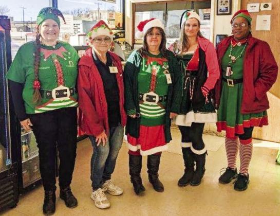 Market Square Supermarkets’ Angela Petree, left, Winnie Black, Velvet Burkenbine, Toni DeHerrera and Angie McDanel appear as Santa’s elves for Christmas Eve. The staff appreciates so many customers shopping local for a record sales day even with a 6 p.m. closing. The Wellington store closed Sunday, Dec. 25 so employees could spend time with family and friends. Courtesy Photo