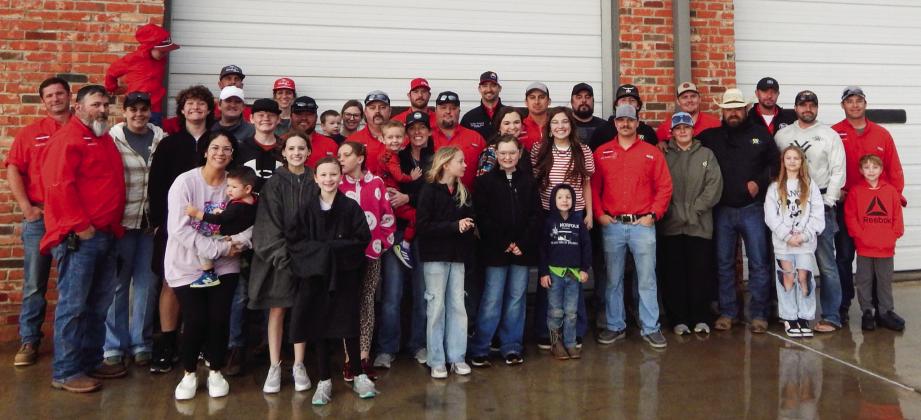 The Wellington Volunteer Fire Department family and Brothers-Sisters of our Military (B.O.O.M.) Adventures volunteers gather in front of the fire station to show support for the Salinas family prior to the 3 p.m. bucket raffle drawing Sunday afternoon.