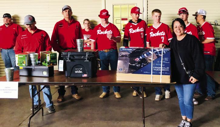 Maria Granados holds the winning ticket for the Montezuma Triangle Toolbox, donated by Bawcom Supply, in the Salinas bucket raffle fundraiser. Skyrocket baseball players assisted the firemen in drawing and announcing winning ticket numbers. From left: Chance Byers, Ethan Cummings, Kollin Kemp, Noah Cantu, Maggie Tillman, Hunter Hedrick, Leo Granadoz, Jax Heflin, Lawson Inman, Alex Orozco.