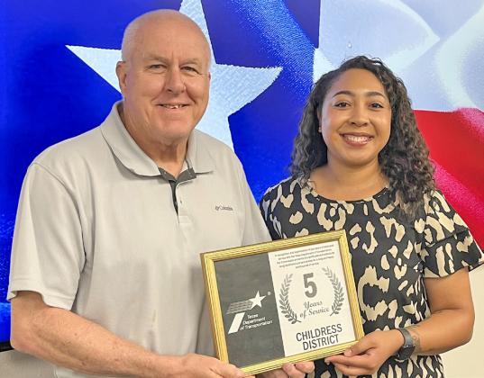 Texas Department of Transportation (TxDOT) Childress District Designer Kati Garcia, right, accepts a five-year service award from TxDOT Childress District Engineer Darwin Lankford.