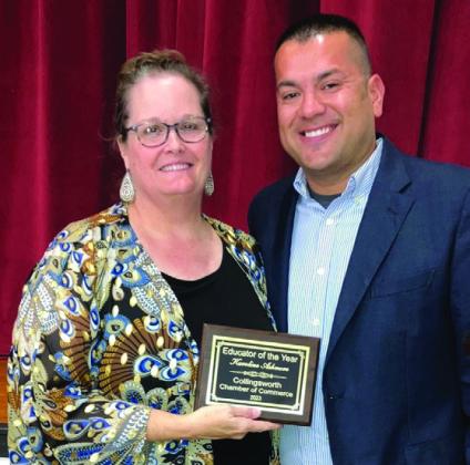 Karoline Ashmore, left, receives Educator of the Year from Jermaine Cantu.