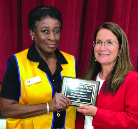 Wellington Lions Club president Vernita Randon, left, accepts the Community Service Award from Karen Caldwell.